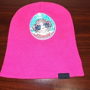 An Emoji beanie in a one size fits most. Hot pink with monkey image.